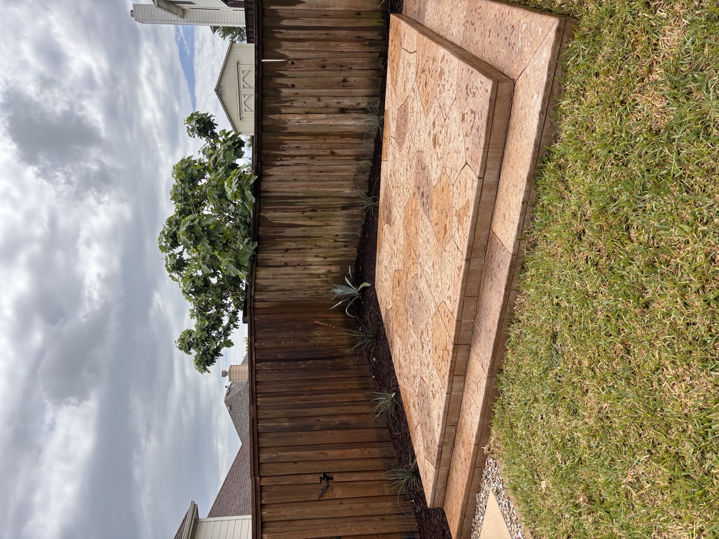 Stamped concrete patio with clean landscape borders